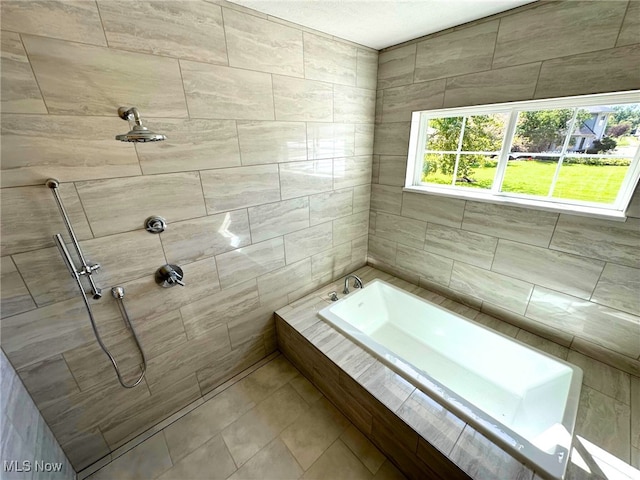 bathroom with shower with separate bathtub