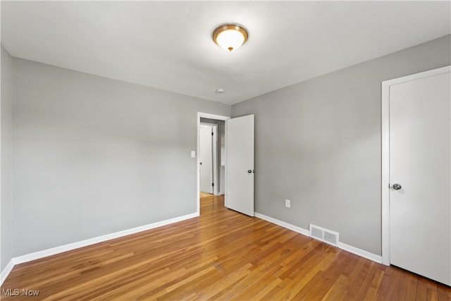 unfurnished bedroom featuring light wood-type flooring