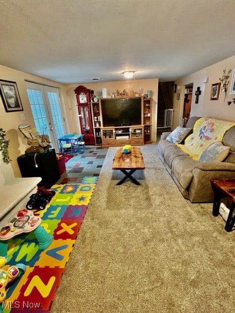 carpeted living room featuring french doors