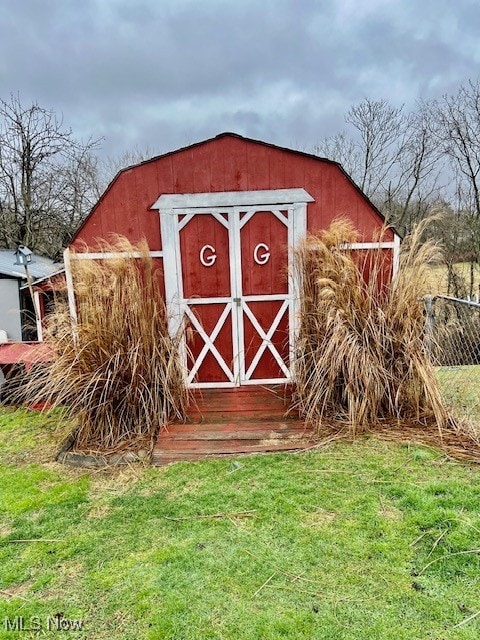 view of outdoor structure with a lawn