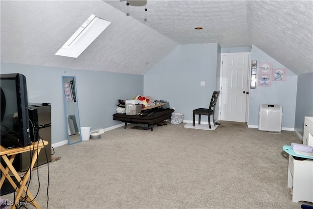 additional living space featuring light carpet and a textured ceiling