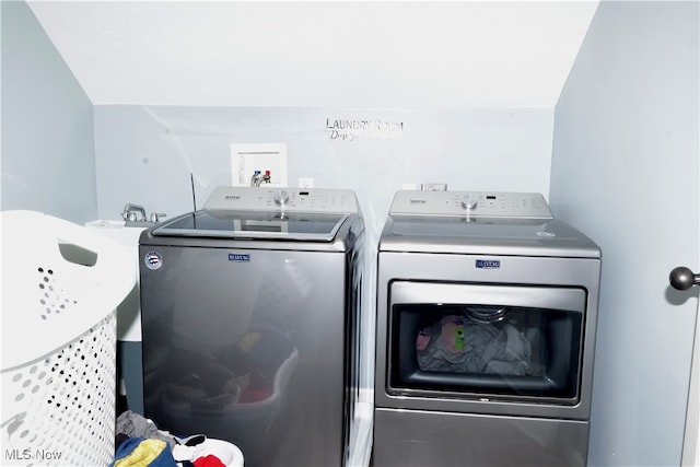 washroom with separate washer and dryer