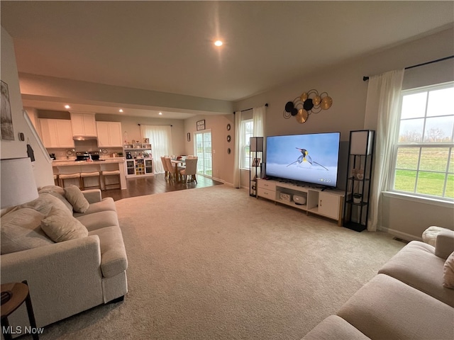 living room featuring light carpet