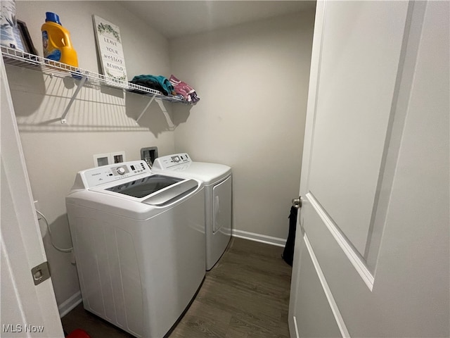 washroom featuring separate washer and dryer and dark hardwood / wood-style flooring