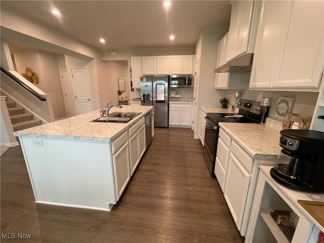 kitchen featuring white cabinetry, sink, dark wood-type flooring, stainless steel appliances, and a center island with sink