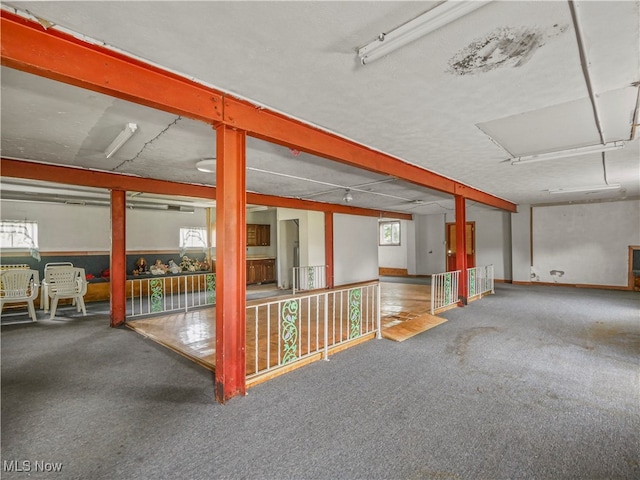 interior space with plenty of natural light and carpet