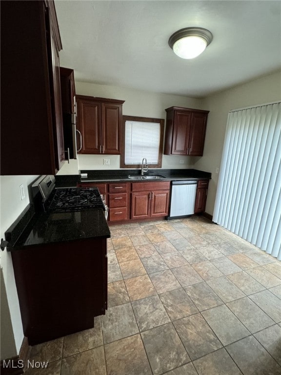 kitchen featuring stainless steel appliances, a healthy amount of sunlight, and sink