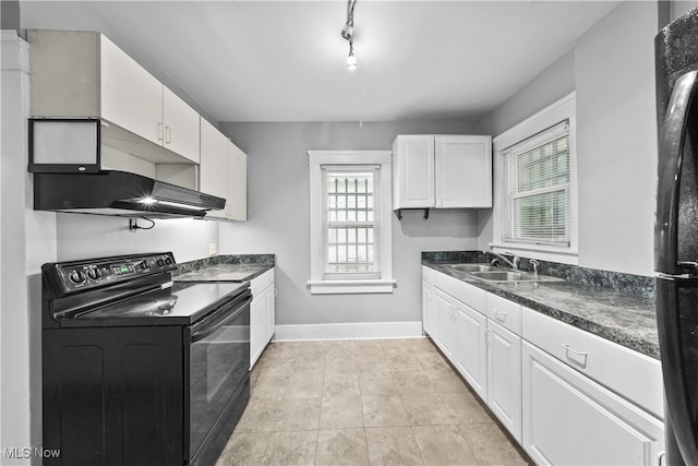 kitchen featuring sink, white cabinetry, a healthy amount of sunlight, and black appliances