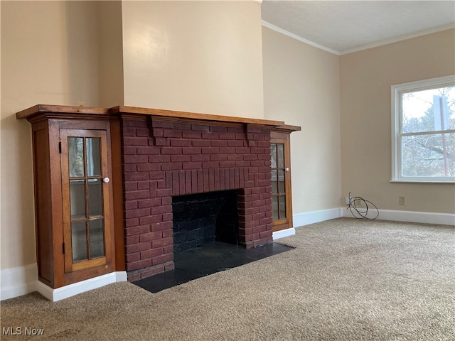 room details featuring carpet floors, ornamental molding, and a brick fireplace