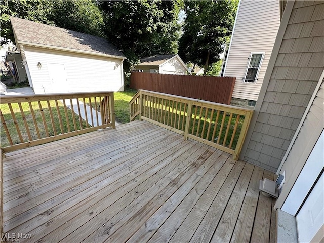 wooden deck with a lawn