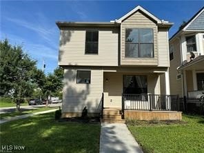 view of front facade featuring a porch and a front yard