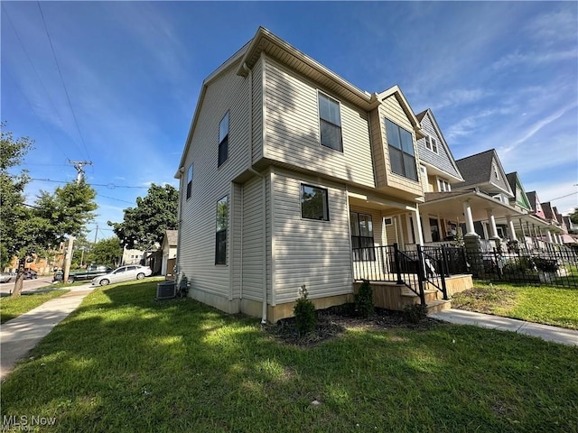 view of front of home featuring covered porch and a front yard