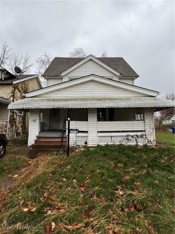 view of side of home featuring a porch