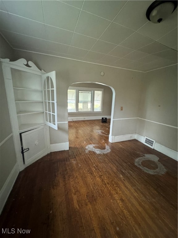 unfurnished living room featuring hardwood / wood-style floors