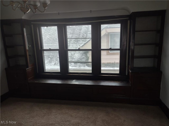 empty room featuring a chandelier