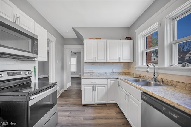 kitchen featuring sink, white cabinetry, and stainless steel appliances