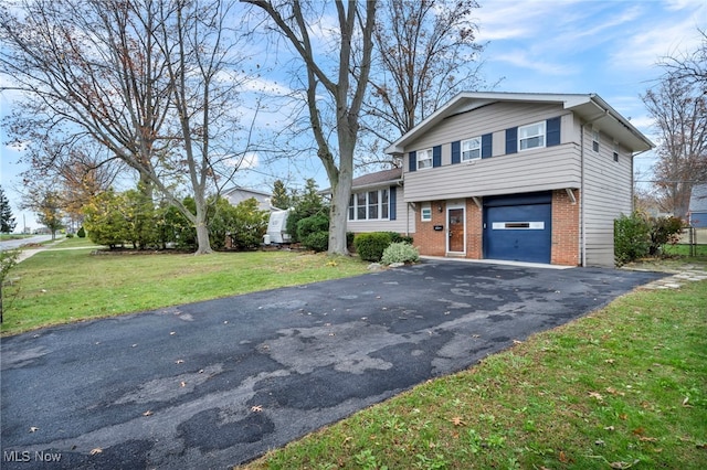 split level home featuring a front yard and a garage