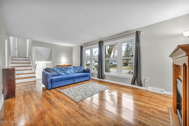 living room with light hardwood / wood-style flooring