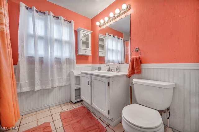 bathroom with tile patterned floors, vanity, and toilet