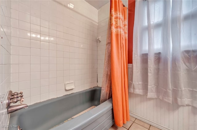 bathroom with tile patterned floors and shower / bathtub combination with curtain