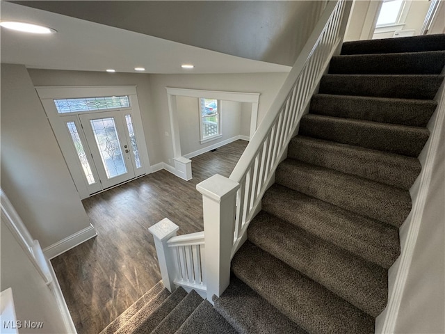 foyer entrance featuring dark hardwood / wood-style floors