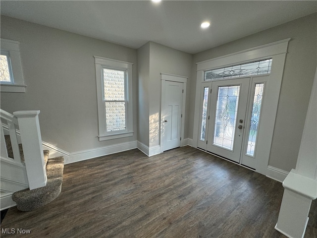 entrance foyer with dark hardwood / wood-style floors