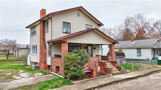 view of front of house with covered porch and central air condition unit