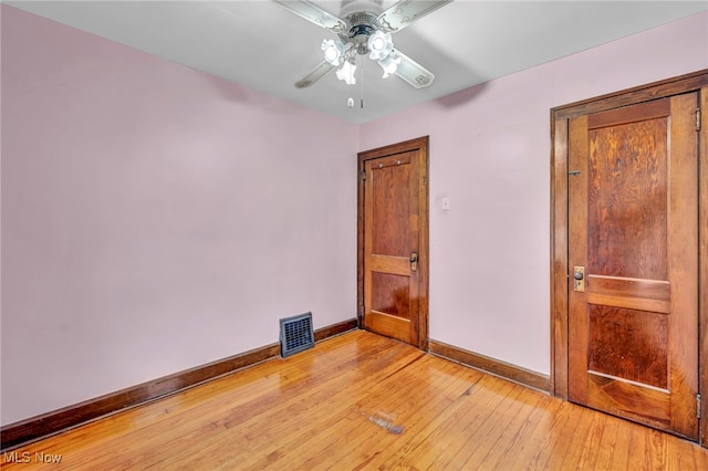 unfurnished room featuring ceiling fan and light hardwood / wood-style flooring