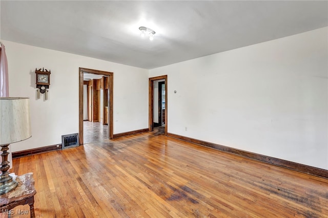 spare room featuring light hardwood / wood-style floors