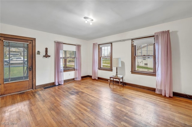 empty room featuring wood-type flooring