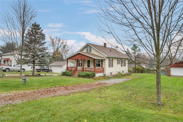 view of side of home featuring a porch and a lawn