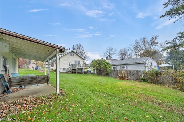 view of yard with a wooden deck