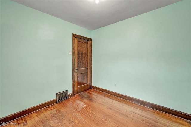 unfurnished room featuring light wood-type flooring