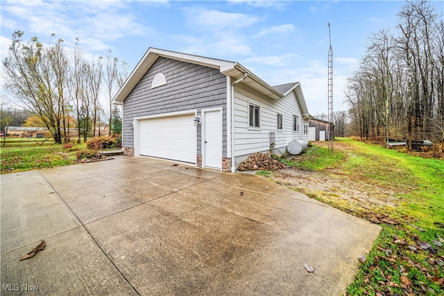 view of side of home with a garage