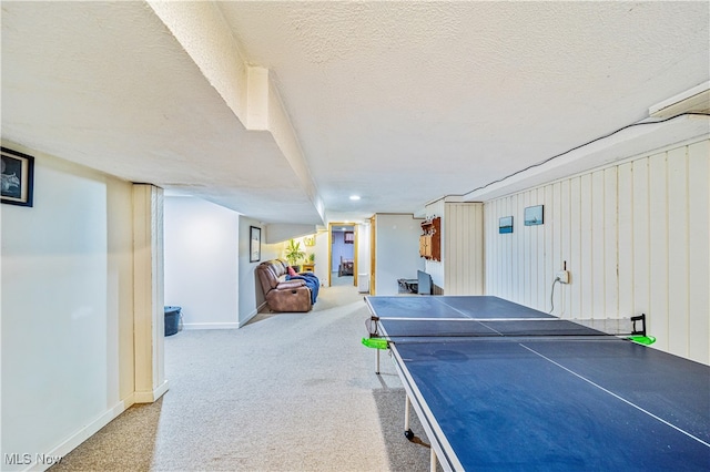 playroom with carpet and a textured ceiling