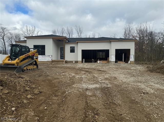 back of property with an outdoor structure