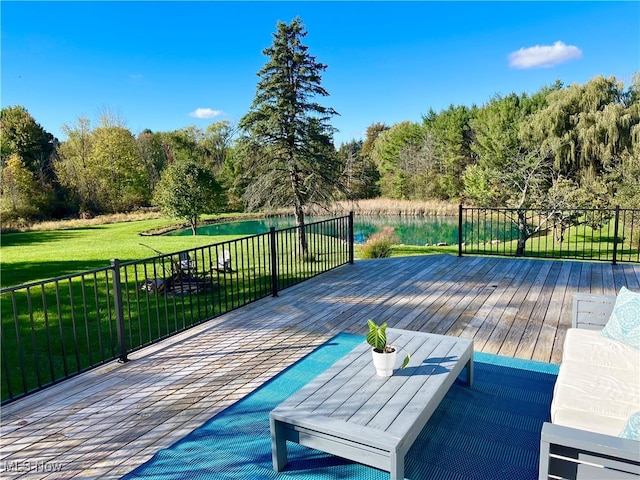 wooden terrace featuring a lawn