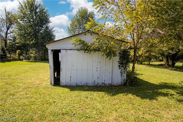 view of outdoor structure with a lawn