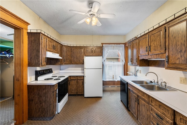 kitchen featuring a textured ceiling, white appliances, light colored carpet, ceiling fan, and sink