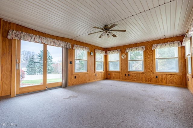 unfurnished sunroom with ceiling fan