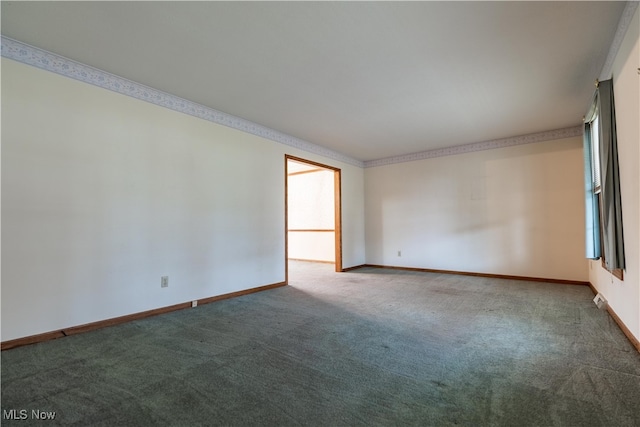 unfurnished room featuring carpet and ornamental molding