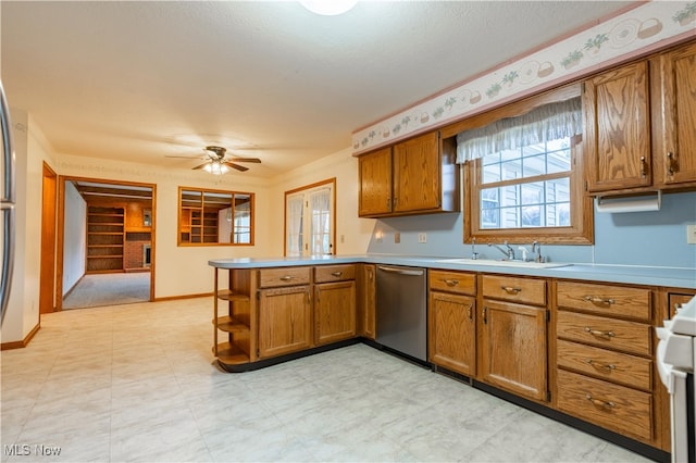 kitchen with ceiling fan, dishwasher, sink, kitchen peninsula, and white stove