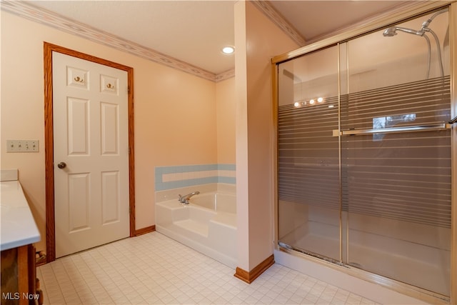 bathroom featuring plus walk in shower, vanity, and ornamental molding