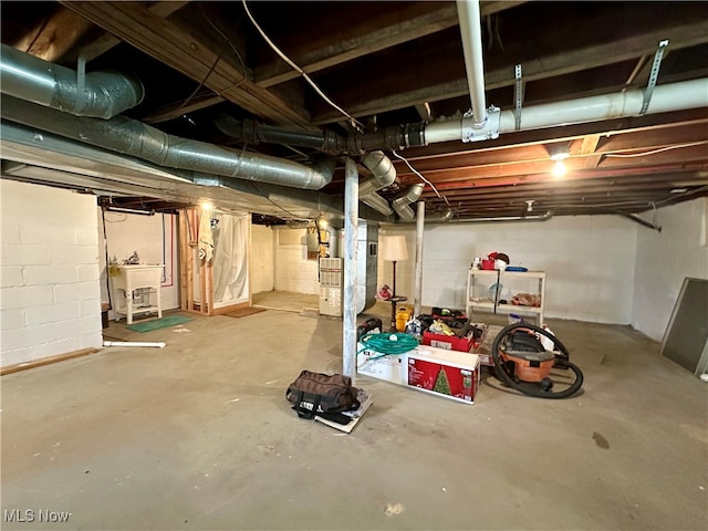 basement featuring heating unit