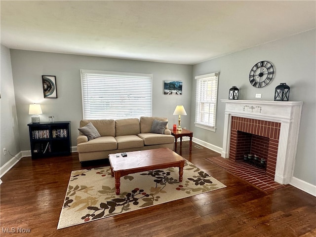 living room with a fireplace and dark hardwood / wood-style floors