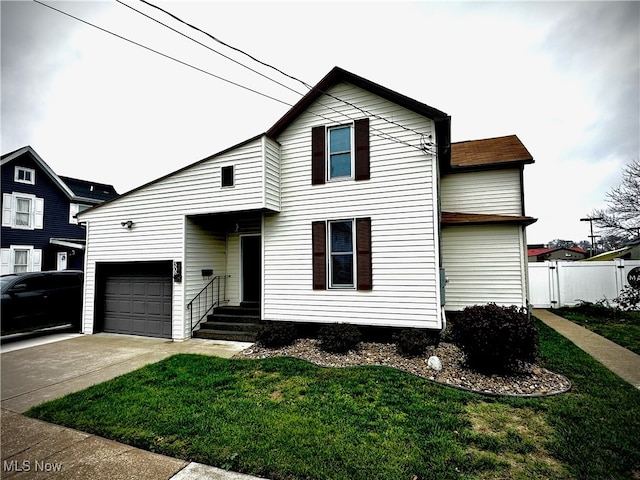 front facade featuring a front lawn and a garage