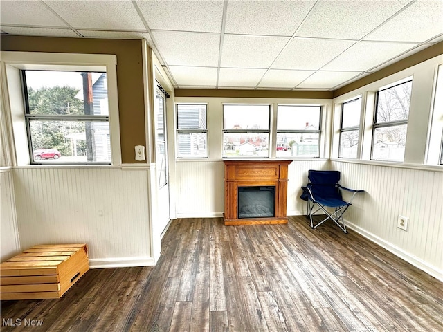 unfurnished sunroom featuring a paneled ceiling