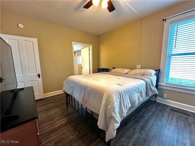 bedroom featuring dark hardwood / wood-style floors and ceiling fan