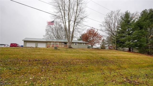 view of yard with a garage