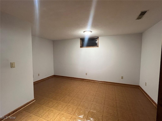 basement with a textured ceiling